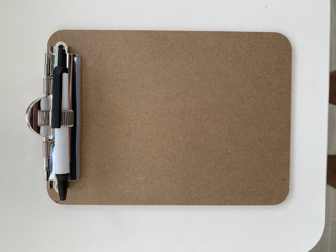 Trade Quest hardboard clipboard with low-profile clip and pen